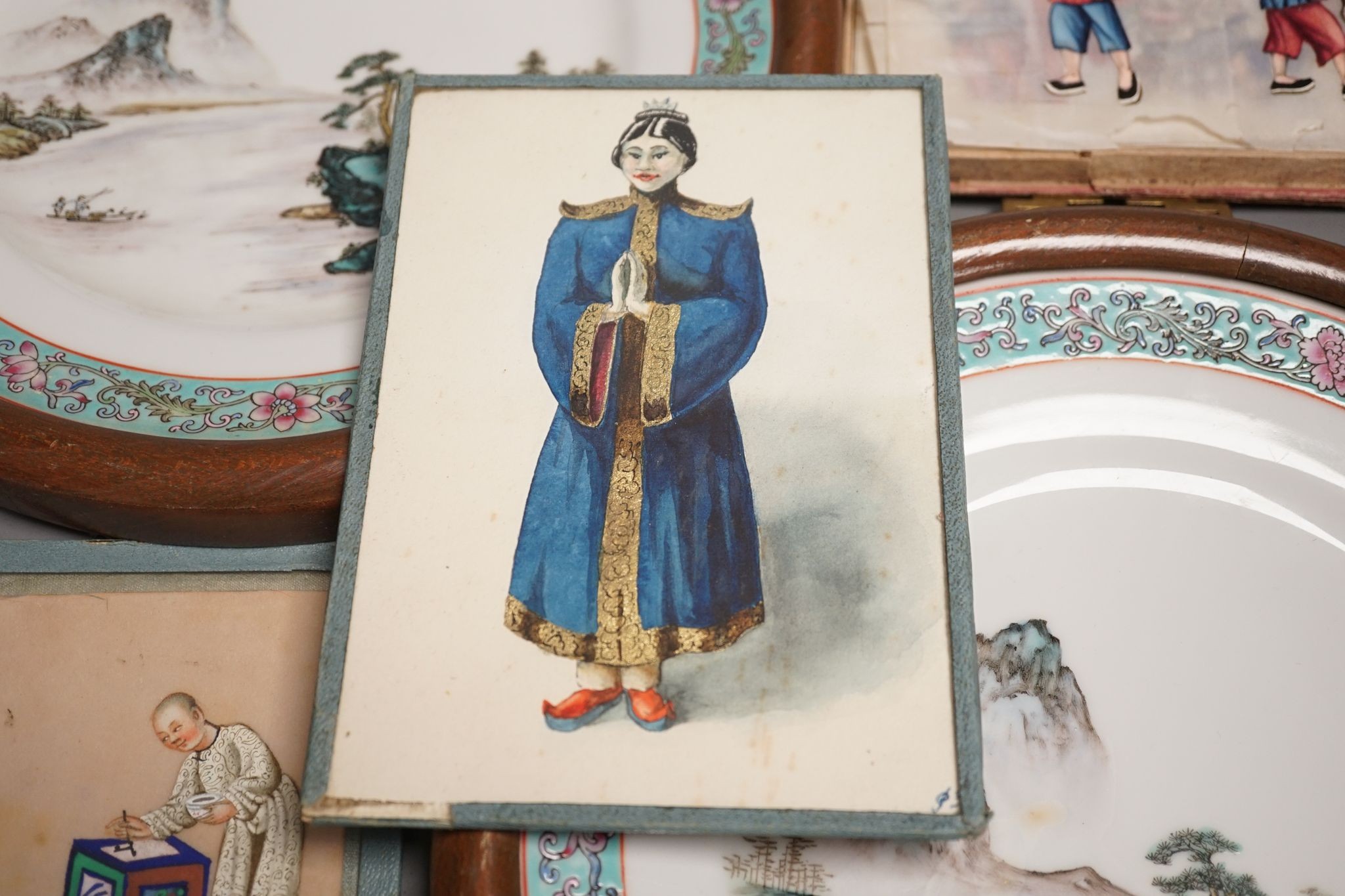 A group of Chinese pith paintings of court figures, production etc. and a pair of Chinese enamelled porcelain plates